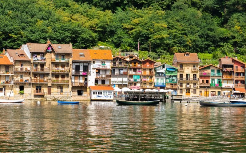 Colourful houses over the water of an estuary