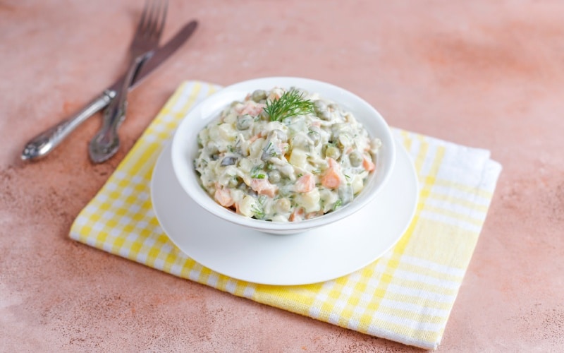 A dish of Russian salad on a table