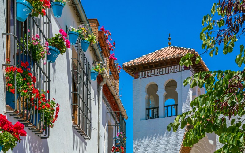 White houses with flowers in the balconies