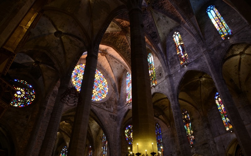The interior of the cathedral with staind glass windows and columns