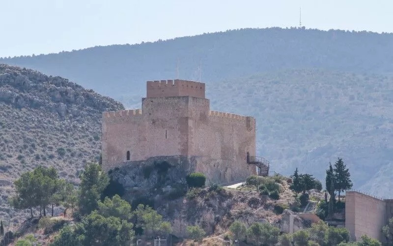 A square-shaped castle in the mountains