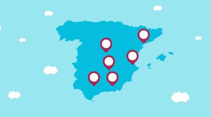 A blue map of Spain with red marks