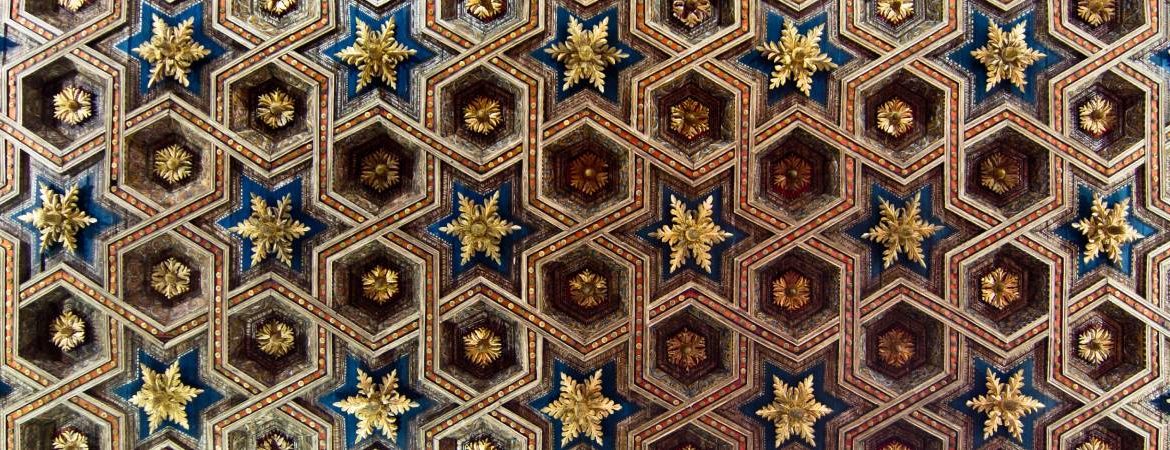 A beautiful ceiling with star shapes and golden pieces