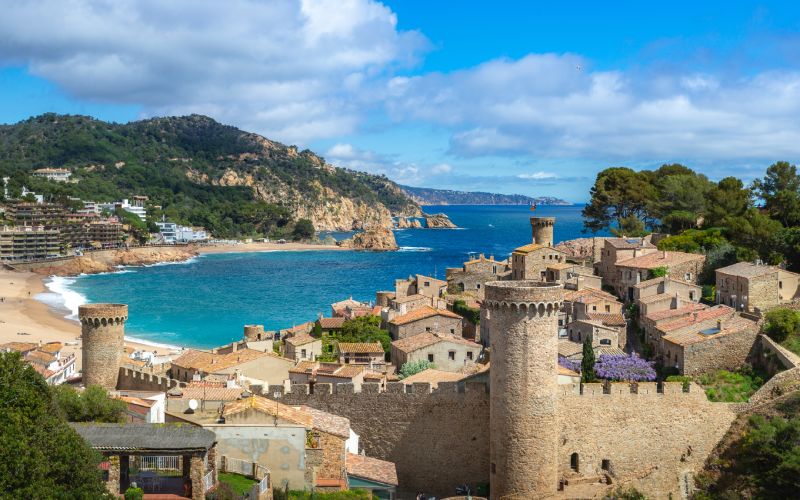 Panoramic view of the beach and castle of Tossa de Mar