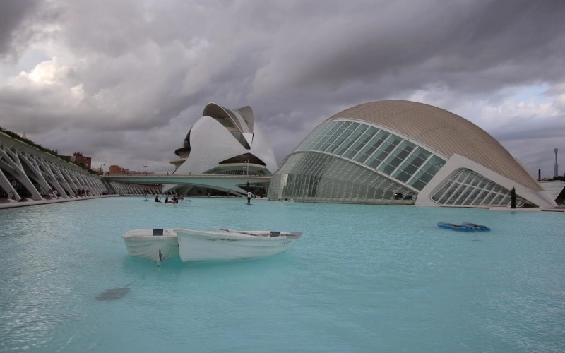 Futuristic buildings over blue water
